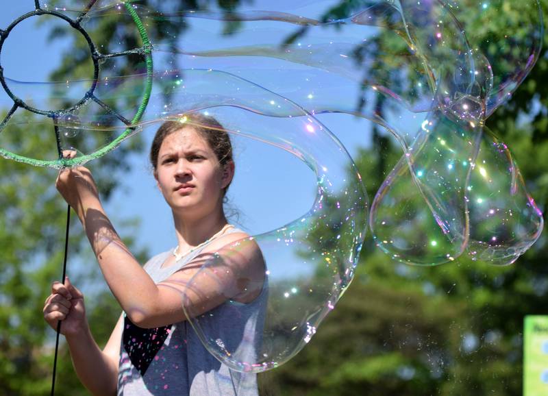 Lots of children participate in the Absolute Science Bubble Open House on June 20 at the Newton Public Library.