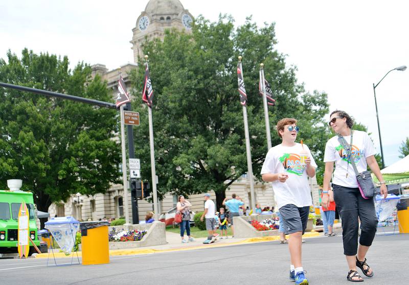 Attendees of RAGBRAI roam the streets of downtown Newton in 2018. The Jasper County Board of Supervisors on June 27 decided to close a number of its buildings – including the courthouse – when RAGBRAI cyclists come through town on July 27.