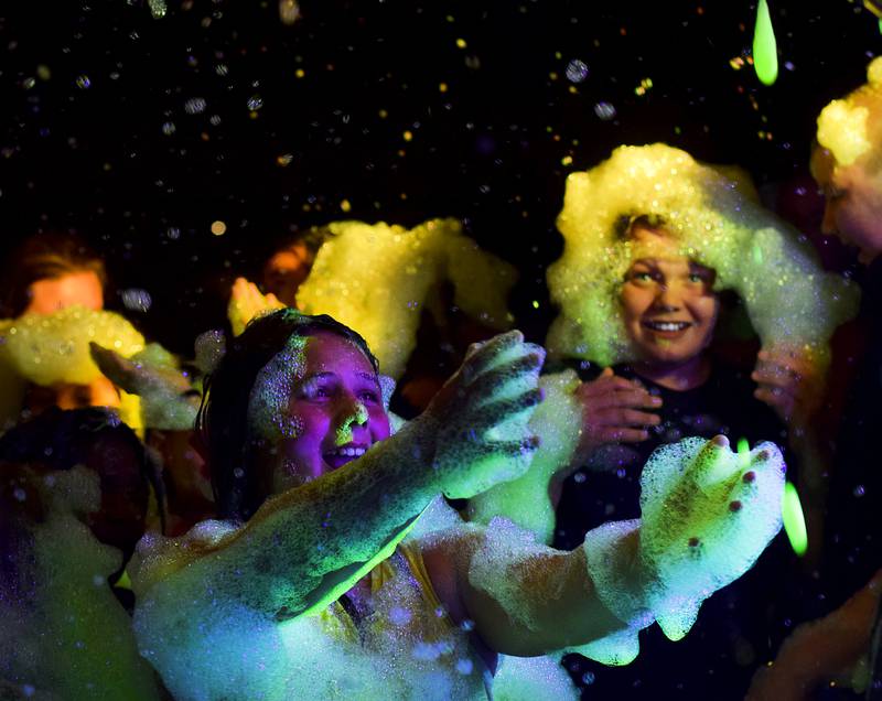Kids enjoy the return of the Glow Foam Party – which featured two cannons this year – during Newton Fest on June 7 at Maytag Park.