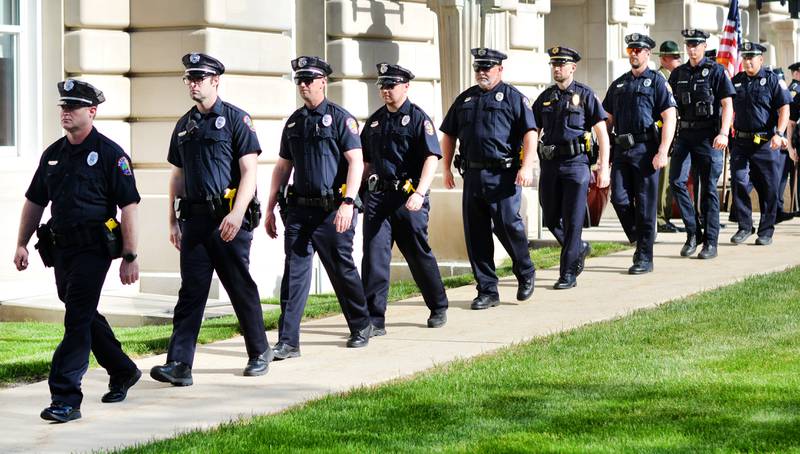 Local law enforcement participate in the National Police Week Ceremony on May 15 at the Jasper County Courthouse in Newton. Community members attended the event to honor the six officers who had made the ultimate sacrifice.