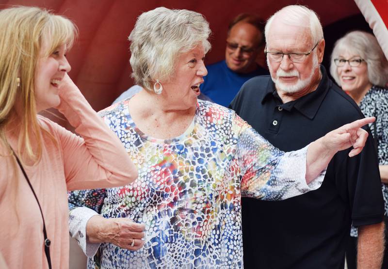 Newton High School graduates gather for drinks and camaraderie at the all-class reunion June 7 at Legacy Plaza. Newton Alumni Weekend brought back Cardinals for a weekend of partying and fellowship.