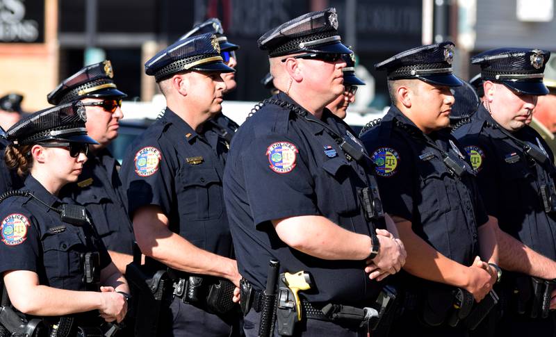 Officers of the Newton Police Department stand at attention during the National Police Week ceremony May 12 at the Jasper County Courthouse.