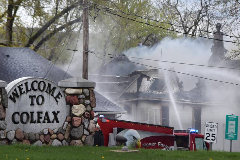 Firefighters from multiple agencies in Jasper and Polk Counties respond to a house fire on Thursday, April 20, near the 300 block of South Walnut Street in Colfax.