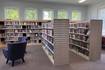 Library updates area with shelving and chairs