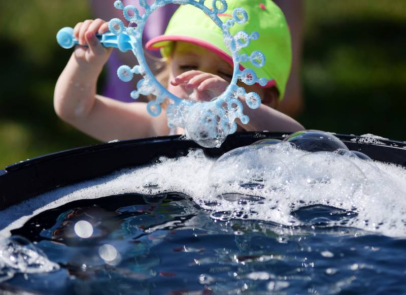 Lots of children participate in the Absolute Science Bubble Open House on June 20 at the Newton Public Library.