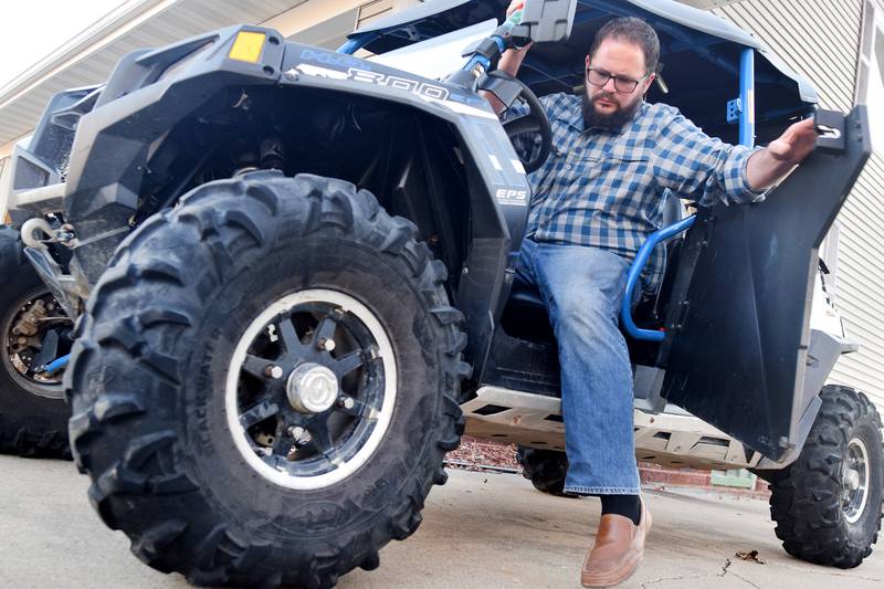 Brady Archibald, of Newton, steps out of his UTV. The city council will be reviewing the third reading of a proposed ordinance allowing limited use of properly equipped ATVs and UTVs on city streets at the Nov. 7 council meeting.