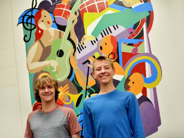 Two NHS vocalists performing All-State Chorus concert