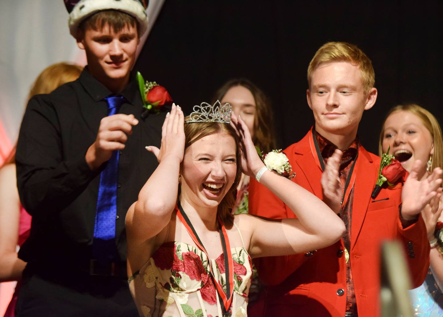 Kaitlyn Bloom, a senior at Newton High School, reacts to being crowned homecoming queen during a coronation ceremony on Sept. 15 inside the high school gymnasium.