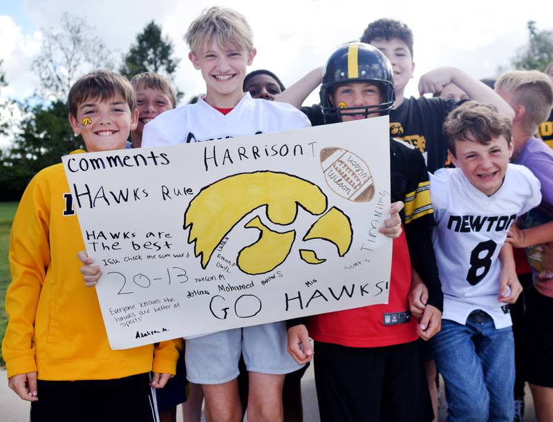 Students wearing Cyclone and Hawkeye apparel pose for pictures on Sept. 4 outside Berg Middle School. The whole study body was invited to welcome RVTV to town.
