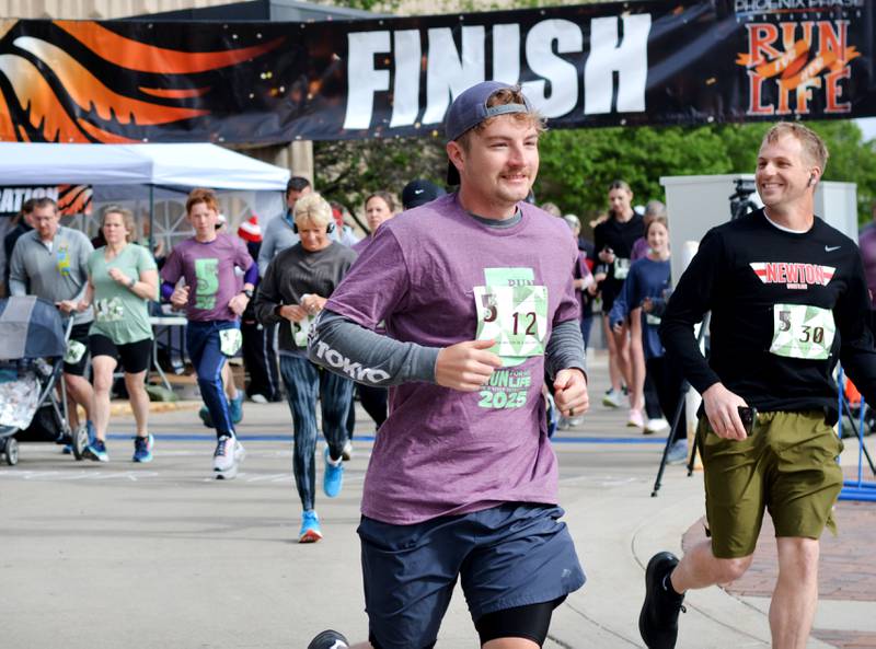Runners participate in The Phoenix Phase Initiative's fifth annual Run For Her Life 5K and Half-Marathon on May 17 at Legacy Plaza in Newton. More than 110 people showed up for the run.