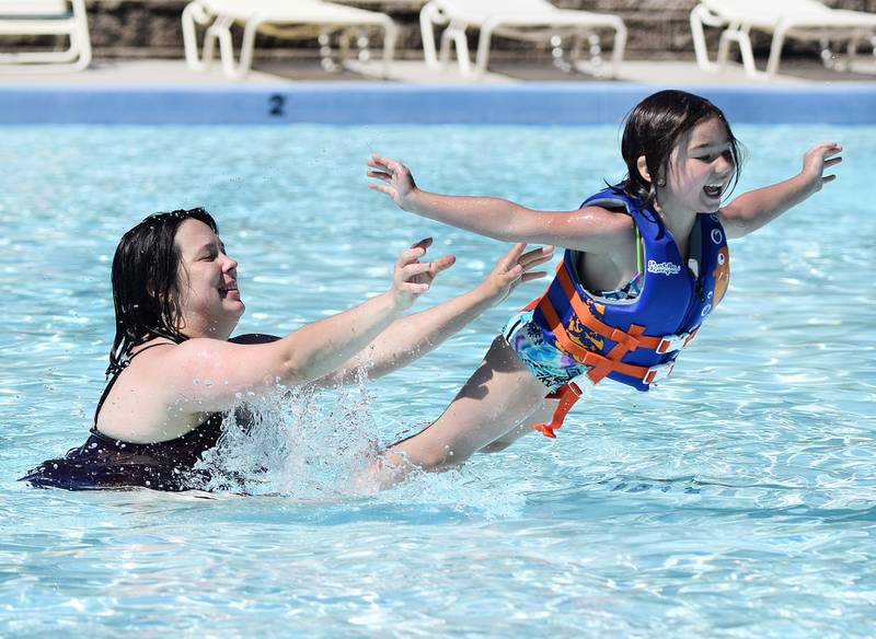 RubySeu Kohlmeyer, 5, launches herself into the water on June 1, 2021, during the opening day of Maytag Pool.