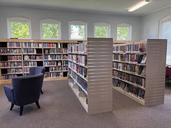 Library updates area with shelving and chairs