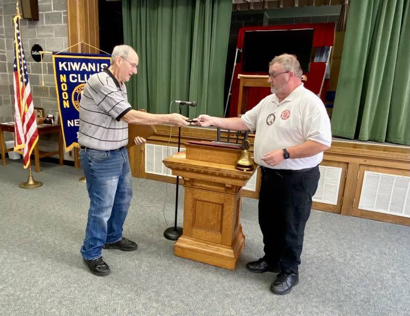 Doug Garrett, representing Quarry Springs Park in Colfax, accepted a Kiwanis pen from Newton Salvation Army Capt. Tim North.