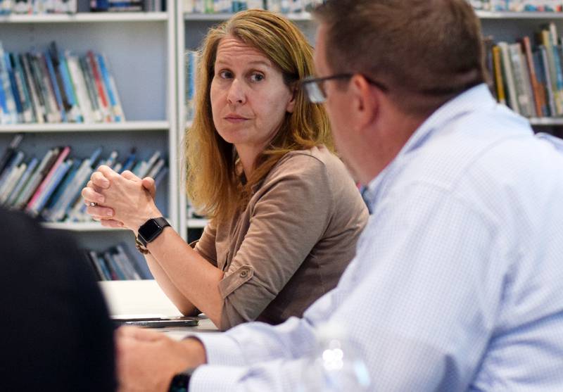 Robyn Friedman, chair of the Newton Community School District Board of Education, participates in a discussion at a part board meeting at the Berg Middle School library.