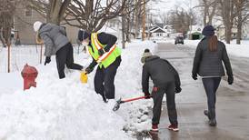 NHS students help fire crews clear fire hydrants