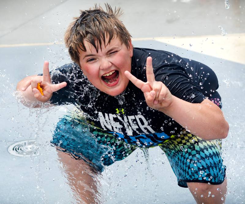 Families and children enjoy the new splash pad facilities. The Greater Newton Area Chamber of Commerce, Newton Main Street and the City of Newton held a ribbon cutting ceremony for the splash pad on June 6.
