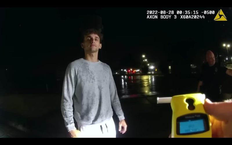 Tayvin Galanakis, 19, was pulled over in late August 2022 by Newton police for using his high beams in town. Officers suspected him of drunk driving, but when a breathalyzer showed no signs of alcohol consumption, they accused him of smoking weed. Galanakis was placed under arrest after he changed his mind about taking a drug evaluation. When he took that same evaluation at the station, it showed no evidence of impairment or drug use. He was then released. Galanakis shared his experience online and it subsequently went viral.