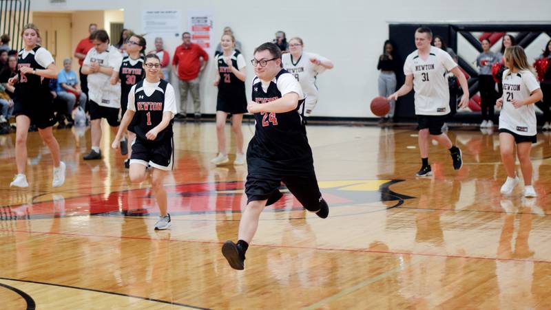 Sam Simon hustles down the court during The Big Game on April 19 at Newton High School.