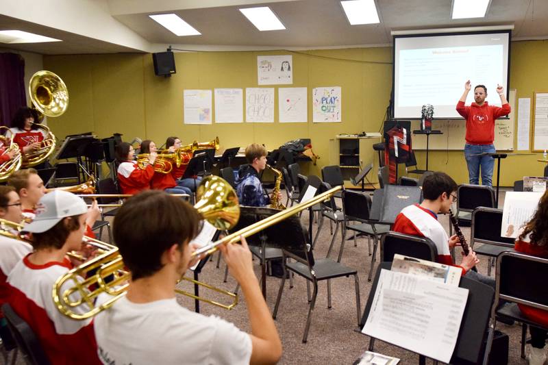 Newton alumni and students have a jam session on Dec. 16 in the band room of Newton High School. Current and past members of the Newton High School band on Dec. 16 participated in the inaugural Alumni Pep Band Night. Adam Kallal, the band director at Newton High School, organized the event in hopes it would become an annual celebration.