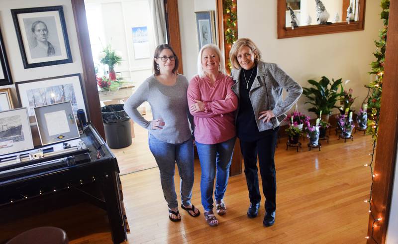 From left: Jerrica Pietz, Jennifer Zimmerman and Pauli Zmolek Eades of Blooms by Design and Cardinal Frame Shop. The two businesses reside under one roof in Newton, and although a floral shop and a frame shop are quite different from each other they both require an artistic eye.