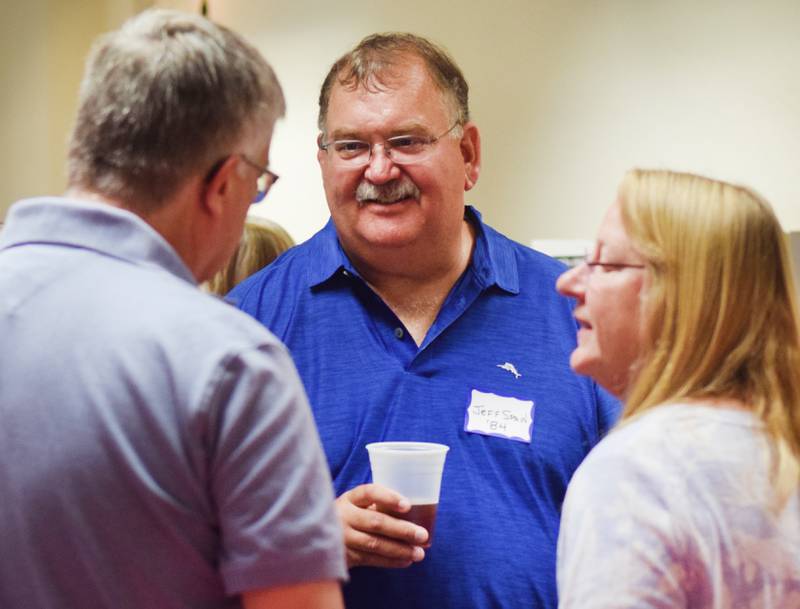 Newton High School graduates gather for drinks and camaraderie at the all-class reunion June 7 at Legacy Plaza. Newton Alumni Weekend brought back Cardinals for a weekend of partying and fellowship.