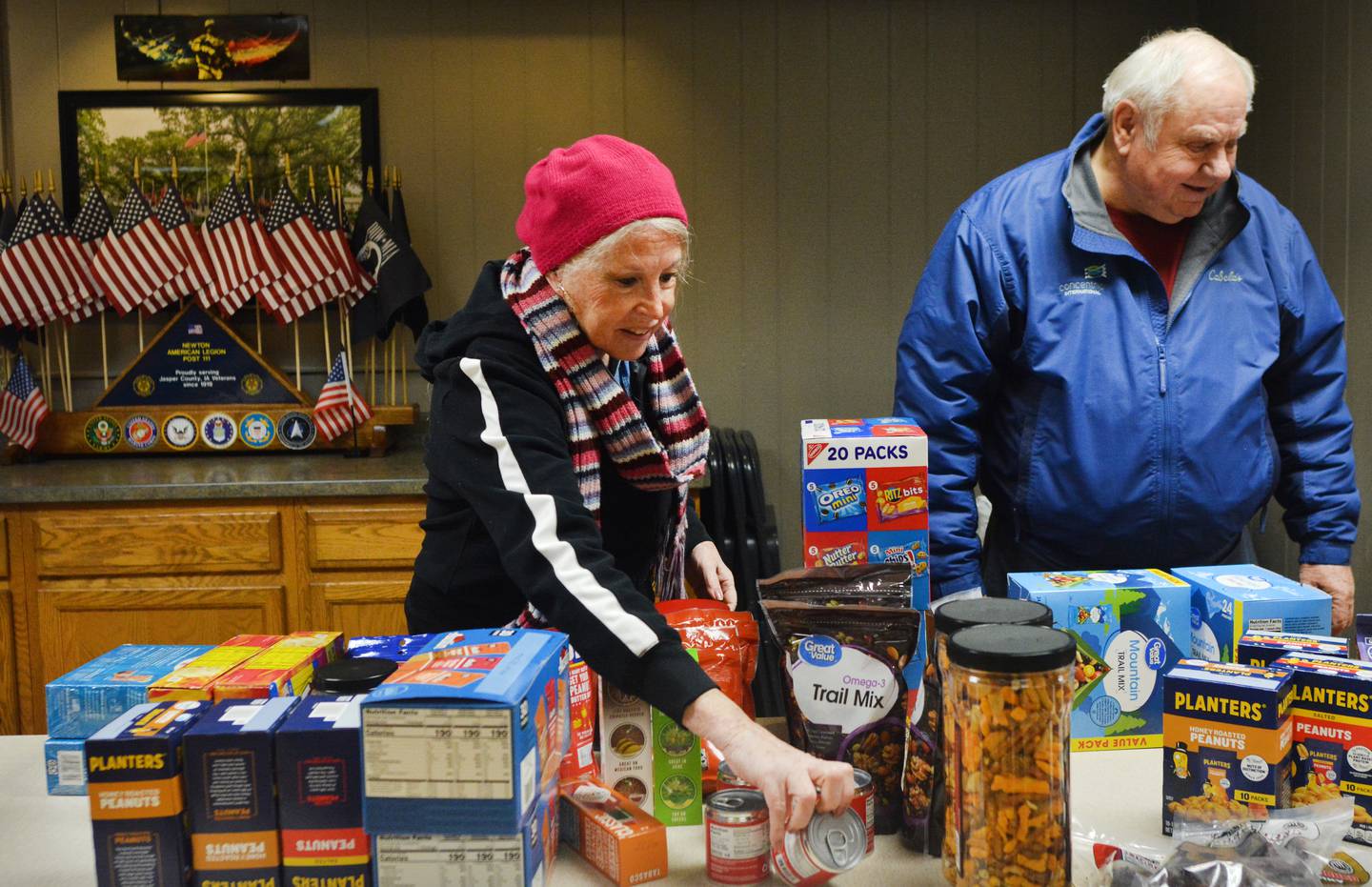 Volunteers and veterans participate in a care package event Monday, Dec. 29, 2025 at the American Legion Post 111 in Newton. The care packages will be going to the unit of the two Iowa National Guard soldiers who were killed in action in Syria.