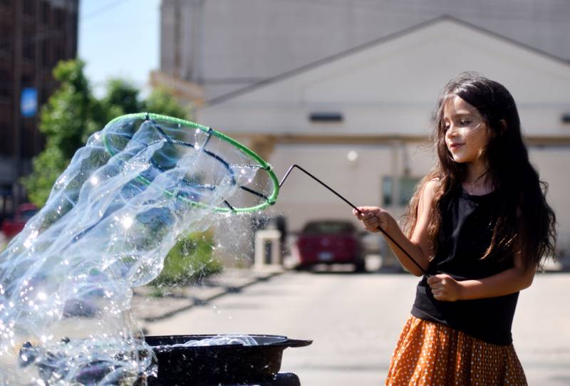 Lots of children participate in the Absolute Science Bubble Open House on June 20 at the Newton Public Library.