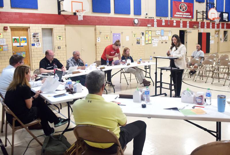 Rachelle Hines of FRK Architects + Engineers speaks to Newton school board members during the May 22 meeting at Aurora Heights Elementary School.