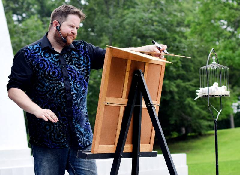 Eric Michaels performs magic and illusions during Newton Fest on Saturday, June 10 at Maytag Park.