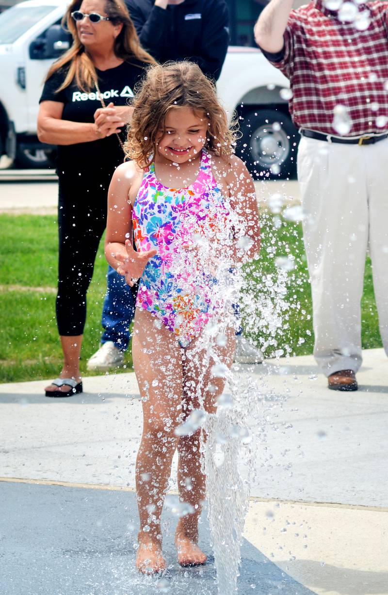 Families and children enjoy the new splash pad facilities. The Greater Newton Area Chamber of Commerce, Newton Main Street and the City of Newton held a ribbon cutting ceremony for the splash pad on June 6.