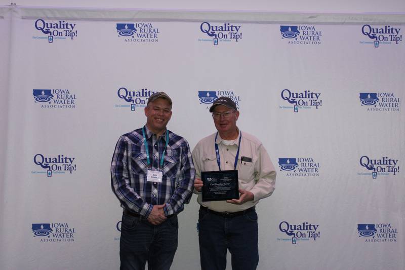 Pictured is Zeb Mc Farland, Iowa Rural Water Association Circuit Rider and award recipient Carl Van Der Kamp.