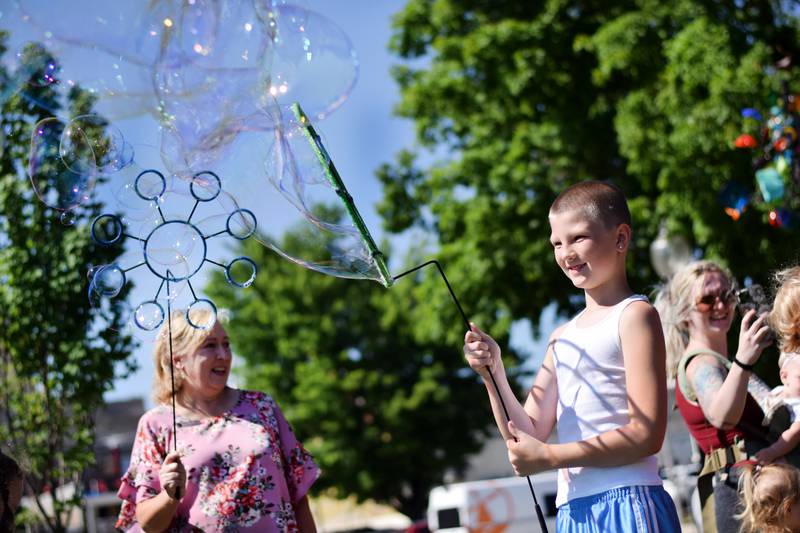 Lots of children participate in the Absolute Science Bubble Open House on June 20 at the Newton Public Library.