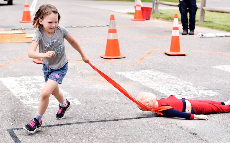 Local first responders show off emergency vehicles and have kids participate in an obstacle course as part of Safety Fest during Newton Fest on Saturday, June 10 at Maytag Park.