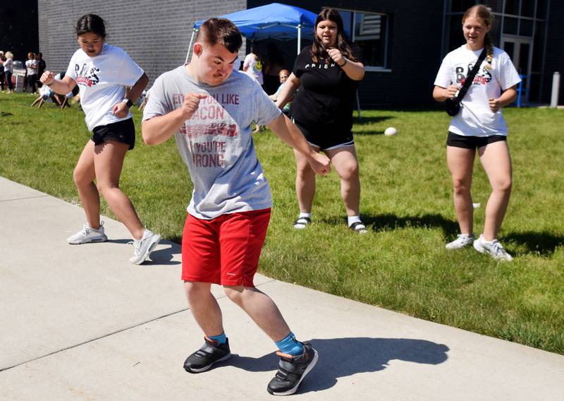 Eighth-grade students at Berg Middle School celebrate their last day as middle schoolers on May 26 by participating in carnival activities.