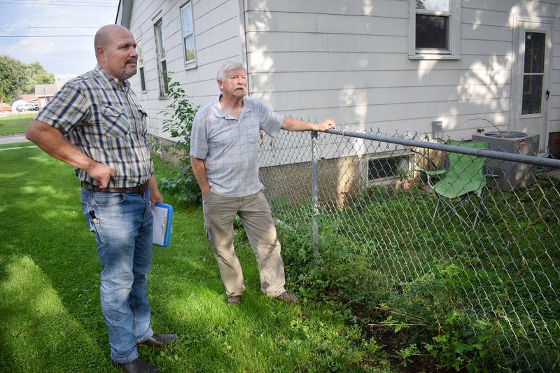 Jason VanAusdall, a contracted rental property inspector of Iowa Inspections, conducts a rental property assessment in 2019.