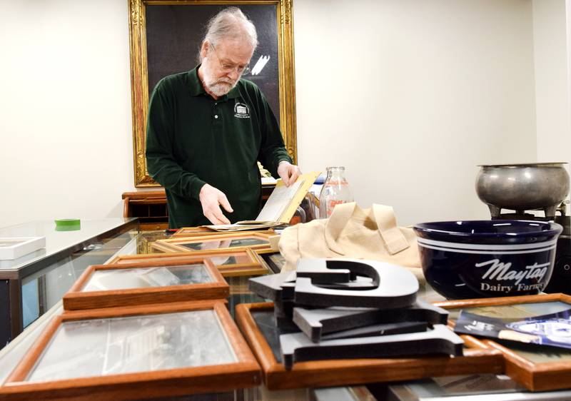 Ken Barthelman, executive director of the Jasper County Historical Museum, looks through the folders of his display information April 27 at the Newton-based museum. Jasper County Historical Museum opens for the season May 1.