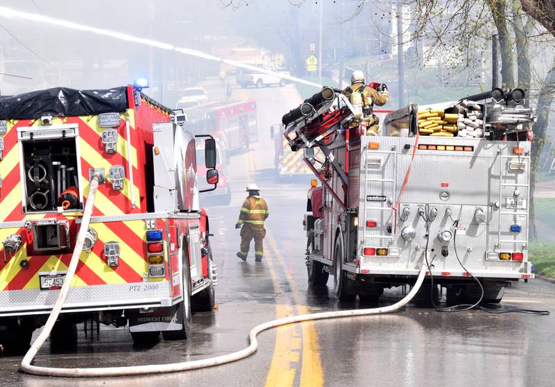 Firefighters from multiple agencies in Jasper and Polk Counties respond to a house fire on Thursday, April 20, near the 300 block of South Walnut Street in Colfax.