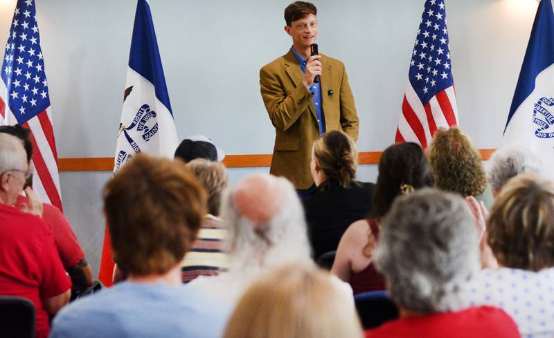 Rob Sand, the state auditor of Iowa running for governor, speaks with guests at a recent town hall on Aug. 6 at the Newton Arboretum & Botanical Gardens.