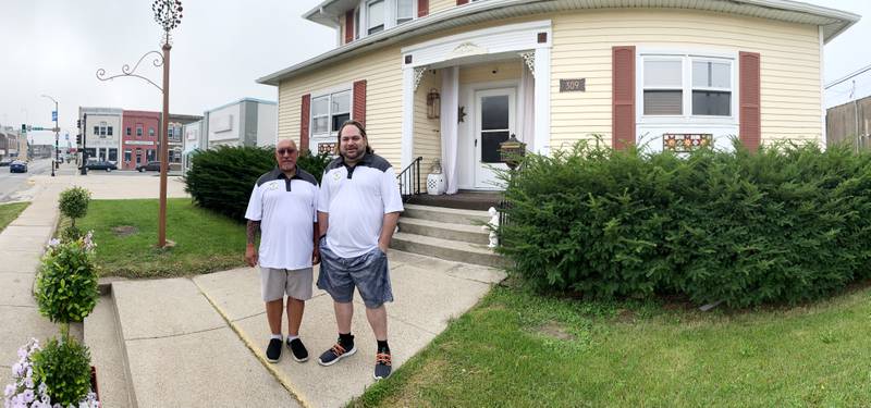 Carl Hentsch and Matt Roberts, owners of Betty J's Mercantile, stand outside their residence and business at 309 First Ave. W. in Newton, which was approved for business and residential improvement grants.