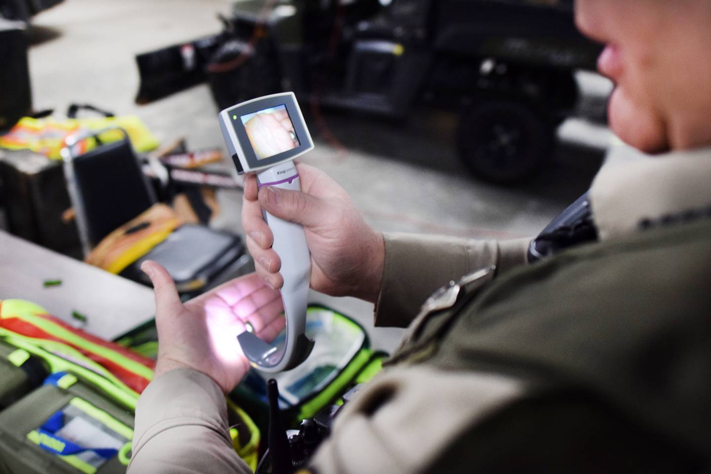 Steve Ashing, a reserve deputy paramedic for the Jasper County Sheriff's Office, tests a laryngoscope that has a monitor attached to it, allowing the user to see any obstructions in a patient's airway. Ashing is part of the advanced life support pilot program at the sheriff's office, which allows part-time reserve deputies with paramedic-level training to respond to emergency calls in rural areas and assist volunteer agencies.