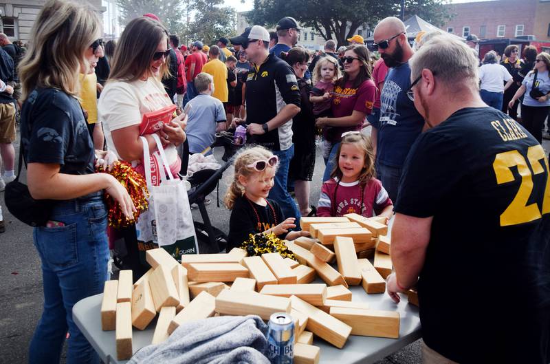 Young Hawkeye and Cyclone fans participate in games during RVTV celebrations on Sept. 4 in downtown Newton.