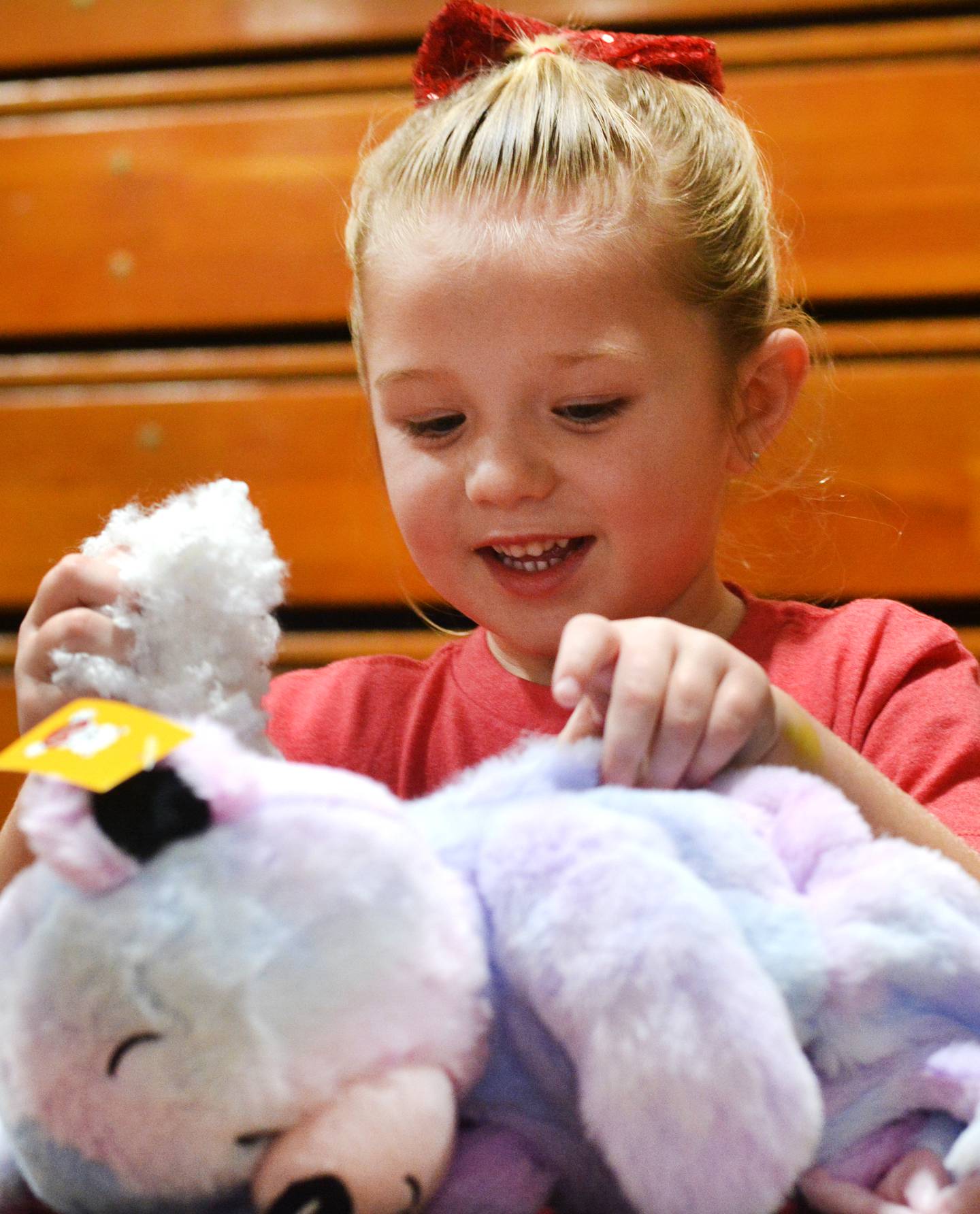 Everleigh Pearson, 4, stuffs a teddy bear during a fundraiser for the United Way of Jasper County and Newton Pacesetters on Dec. 12 at Newton High School.