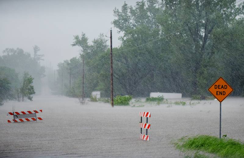 Floodwaters on May 21 overtake a dead end road that had previously been barricaded. Heavy rainfall overnight compromised a number of creeks and the Skunk River, which affected a number of communities in Jasper County.