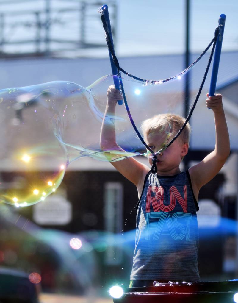 Lots of children participate in the Absolute Science Bubble Open House on June 20 at the Newton Public Library.