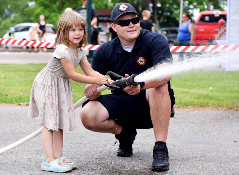 Local first responders show off emergency vehicles and have kids participate in an obstacle course as part of Safety Fest during Newton Fest on Saturday, June 10 at Maytag Park.