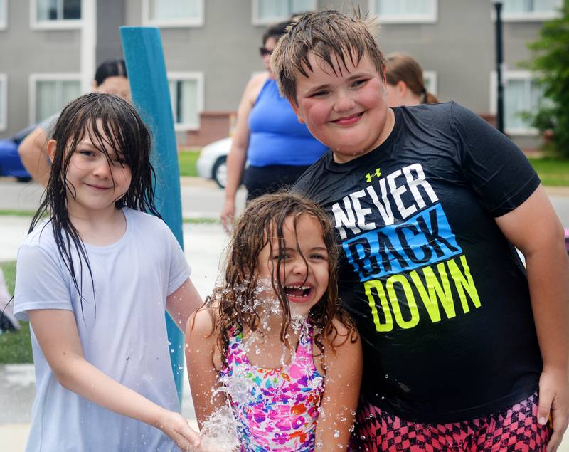Families and children enjoy the new splash pad facilities. The Greater Newton Area Chamber of Commerce, Newton Main Street and the City of Newton held a ribbon cutting ceremony for the splash pad on June 6.