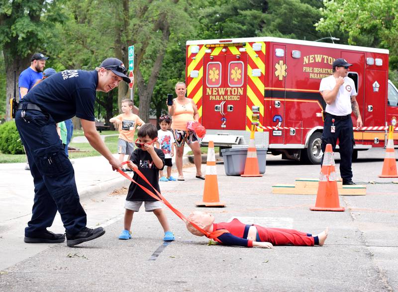 Local first responders show off emergency vehicles and have kids participate in an obstacle course as part of Safety Fest during Newton Fest on Saturday, June 10 at Maytag Park.