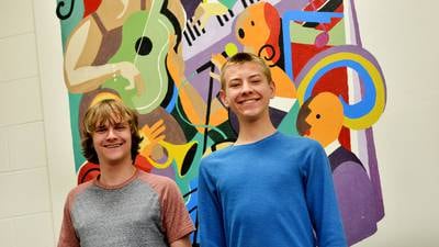 Two NHS vocalists performing All-State Chorus concert