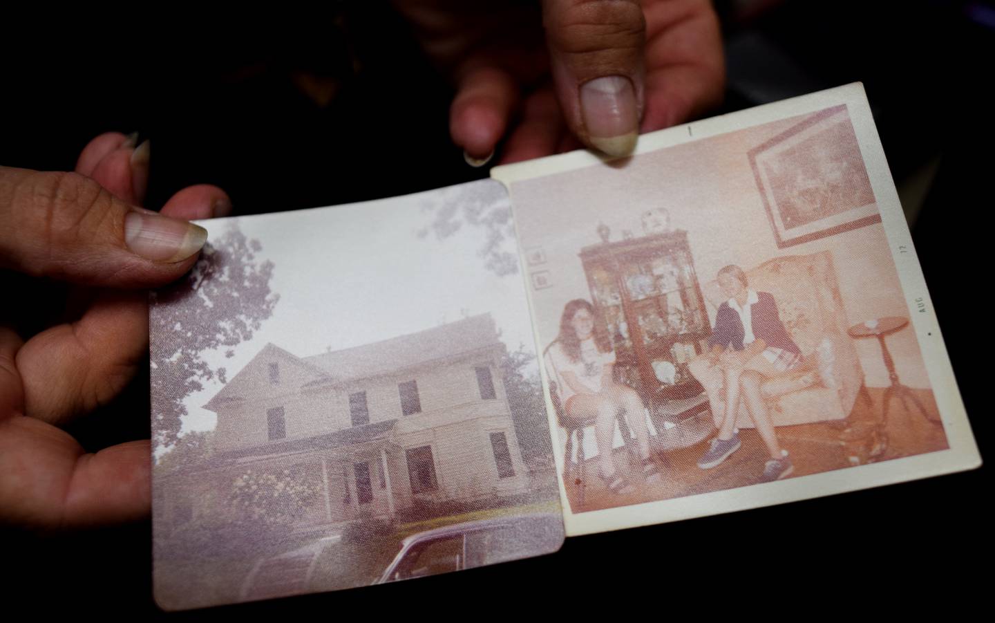 Nancy Sorbella of Carmel, N.Y., shows pictures of what the exterior and interior of a 112-year-old property at 427 N. Third Ave. E. in Newton look like in the past. Sorbella says she has become obsessed with the home, which belonged to her family at one point, and she wants to restore it back to life.