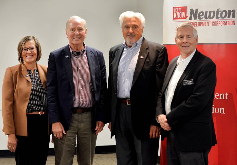 From left: Kim Didier, Rob Denson, Joe Pugel and Frank Liebl pose for a picture during the Newton Development Corporation's Salute to Business & Industry Luncheon. Denson and Pugel were honored at the luncheon for their commitment to DMACC, particularly the Newton campus.